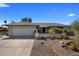 Single-story home with a two-car garage and nicely landscaped yard at 9856 W Rimrock Dr, Peoria, AZ 85382