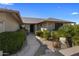 Single story home with walkway leading to front door and well maintained landscaping at 9856 W Rimrock Dr, Peoria, AZ 85382