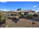 Single-story home with well-maintained landscaping at 9856 W Rimrock Dr, Peoria, AZ 85382