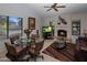 Cozy dining area with fireplace and glass table at 9856 W Rimrock Dr, Peoria, AZ 85382