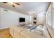 Living Room with sectional sofa, fireplace, and large windows at 760 N Ithica St, Gilbert, AZ 85233