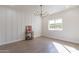 Bright dining room features wood-look floors, shiplap wall, and a modern chandelier at 3909 S Veronica Ln, Gold Canyon, AZ 85118