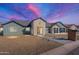Craftsman style home with a two-car garage, landscaped yard and a welcoming front porch at 3909 S Veronica Ln, Gold Canyon, AZ 85118