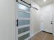 Hallway with barn door and additional white door at 3909 S Veronica Ln, Gold Canyon, AZ 85118