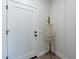 Clean hallway with white door and wall decor at 3909 S Veronica Ln, Gold Canyon, AZ 85118