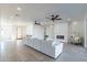 Open living space with sectional sofa, fireplace, and access to the front entry at 3909 S Veronica Ln, Gold Canyon, AZ 85118