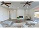 Living area with sectional sofa, fireplace, and access to the backyard at 3909 S Veronica Ln, Gold Canyon, AZ 85118