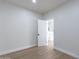 Bright bedroom with wood-look floors and access to bathroom at 3909 S Veronica Ln, Gold Canyon, AZ 85118