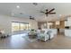 Open concept living area with kitchen views, and sliding glass doors to backyard at 3909 S Veronica Ln, Gold Canyon, AZ 85118