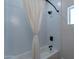Clean bathroom with hexagon tile and a white bathtub at 3909 S Veronica Ln, Gold Canyon, AZ 85118