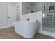 Spa-like bathroom with a freestanding tub and patterned tile shower at 3909 S Veronica Ln, Gold Canyon, AZ 85118