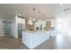 Modern kitchen with white cabinets, stainless steel appliances, and large island at 3909 S Veronica Ln, Gold Canyon, AZ 85118