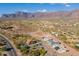 Aerial view of community with mountain backdrop at 3909 S Veronica Ln, Gold Canyon, AZ 85118