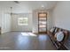 Bright and airy living room with hardwood floors and a modern chandelier at 3909 S Veronica Ln, Gold Canyon, AZ 85118