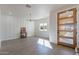 Light-filled dining area with hardwood floors and a modern chandelier at 3909 S Veronica Ln, Gold Canyon, AZ 85118