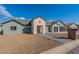 Newly built home with neutral siding and a modern two-car garage at 3909 S Veronica Ln, Gold Canyon, AZ 85118