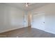 Bright bedroom with wood-look floors and double doors to closet at 3909 S Veronica Ln, Gold Canyon, AZ 85118