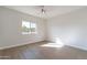 Well-lit bedroom featuring wood-look floors and a window with a view at 3909 S Veronica Ln, Gold Canyon, AZ 85118