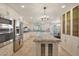 Open kitchen with granite island and stainless steel appliances at 7285 E Arlington Rd, Scottsdale, AZ 85250