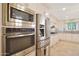 Stainless steel appliances and built-in microwave in this kitchen at 7285 E Arlington Rd, Scottsdale, AZ 85250