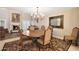 Formal dining room with chandelier and rich wood table at 7285 E Arlington Rd, Scottsdale, AZ 85250