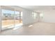 Spacious living area featuring sliding glass doors and tile floors at 10231 E Ulysses Ave, Mesa, AZ 85212