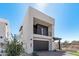 Modern two-story home with dark gray garage door at 10223 E Ulysses Ave, Mesa, AZ 85212
