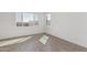 Spacious bedroom with large window and wood-look floors at 10223 E Ulysses Ave, Mesa, AZ 85212