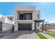 Modern two-story home with dark gray garage door at 10223 E Ulysses Ave, Mesa, AZ 85212