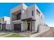 Modern two-story home with dark gray garage door at 10223 E Ulysses Ave, Mesa, AZ 85212