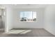 Bedroom with large window, en-suite bathroom, and carpet flooring at 10223 E Ulysses Ave, Mesa, AZ 85212