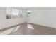 Spacious bedroom with large windows and wood-look floors at 10223 E Ulysses Ave, Mesa, AZ 85212