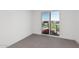 Bedroom with sliding glass doors and view of community at 10223 E Ulysses Ave, Mesa, AZ 85212