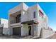 Modern two-story home with dark gray garage door at 10223 E Ulysses Ave, Mesa, AZ 85212
