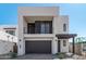 Modern two-story home with dark gray garage door at 10223 E Ulysses Ave, Mesa, AZ 85212
