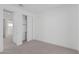 Spacious bedroom with sliding closet doors and access to another room at 10223 E Ulysses Ave, Mesa, AZ 85212