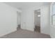 Light-filled bedroom with access to a full bathroom and an additional bedroom at 10223 E Ulysses Ave, Mesa, AZ 85212