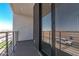 Private balcony with sliding glass doors and views of the surrounding area at 10223 E Ulysses Ave, Mesa, AZ 85212