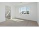 Bedroom with large window, en-suite bathroom, and carpet flooring at 10223 E Ulysses Ave, Mesa, AZ 85212