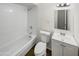 Clean bathroom with white tile and bathtub at 4321 N 50Th Dr, Phoenix, AZ 85031