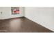 Bright living room with wood-look flooring and large window at 4321 N 50Th Dr, Phoenix, AZ 85031