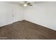 Spacious living room with wood-look flooring and ceiling fan at 4321 N 50Th Dr, Phoenix, AZ 85031