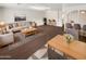 Bright living room with sofa, coffee table, and dining area at 4321 N 50Th Dr, Phoenix, AZ 85031