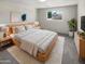 Bright bedroom with wood bed frame and neutral decor at 4321 N 50Th Dr, Phoenix, AZ 85031