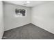 Small bedroom with gray carpet and white walls at 4321 N 50Th Dr, Phoenix, AZ 85031