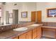 Double vanity bathroom with large mirror and tile at 15972 N 115Th Way, Scottsdale, AZ 85255