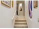 Stairwell with neutral carpeting and framed artwork on the walls at 15972 N 115Th Way, Scottsdale, AZ 85255
