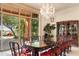 Bright dining room with glass doors opening to a view of the pool and backyard at 15972 N 115Th Way, Scottsdale, AZ 85255
