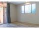 Simple bedroom with sliding door access to patio at 15972 N 115Th Way, Scottsdale, AZ 85255
