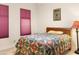 Bedroom with double bed and colorful bedding at 15972 N 115Th Way, Scottsdale, AZ 85255